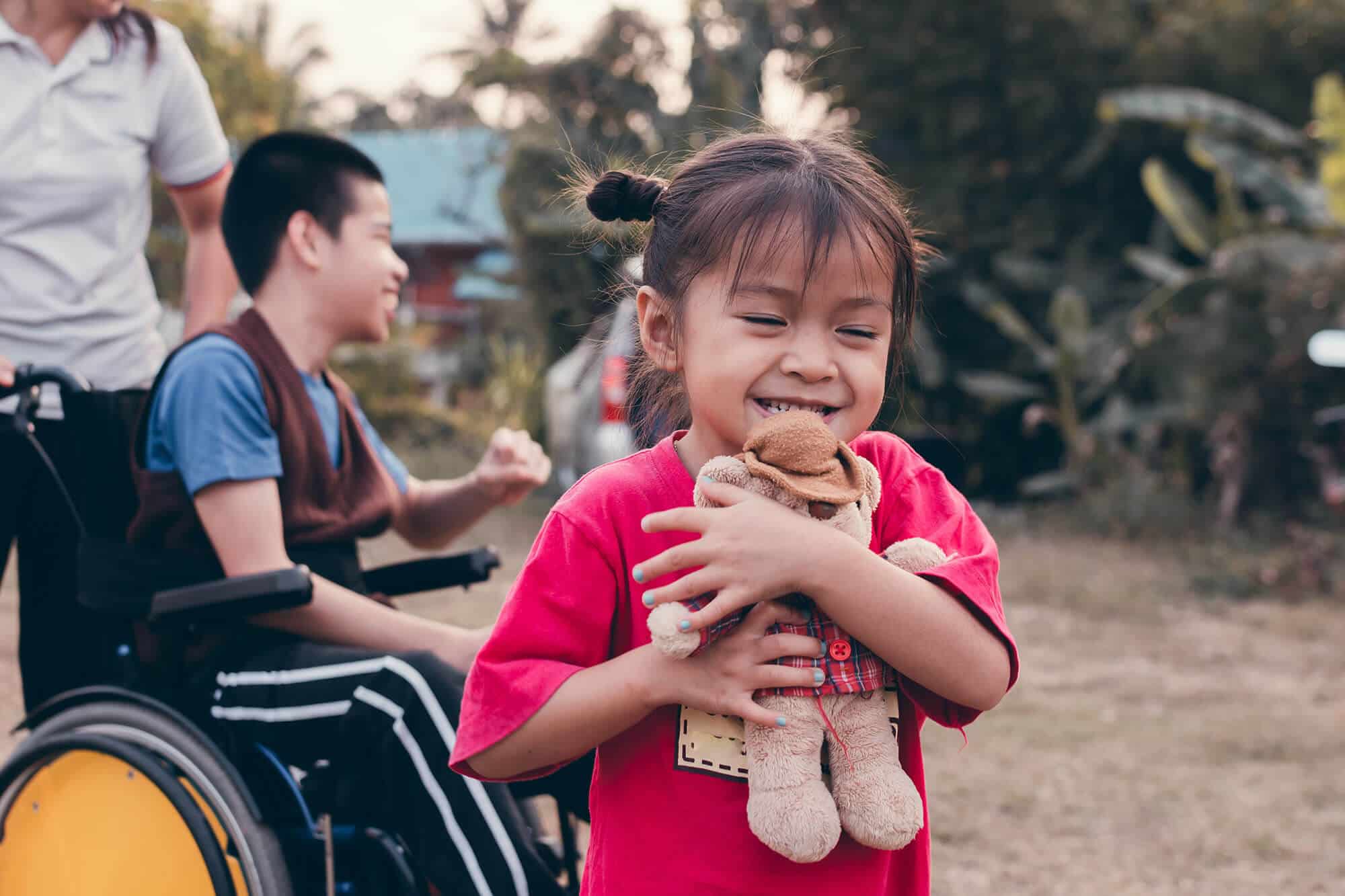 little-girl-and-brother-on-wheelchair-with-outdoor-2023-11-27-04-49-47-utc.jpg